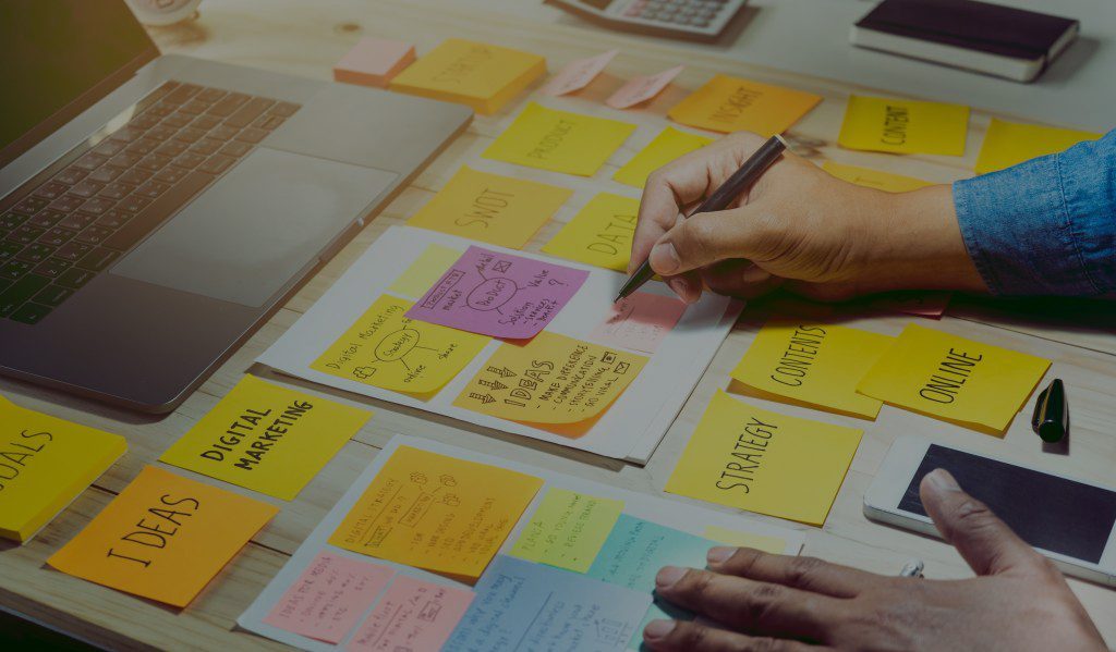 Man working at the table with sticky notes